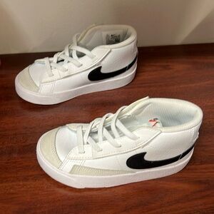 Black and white Nike Blazers